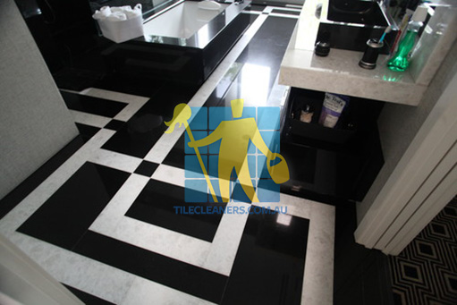 Wollongong absolute black granite slab floor with white quartzite bands