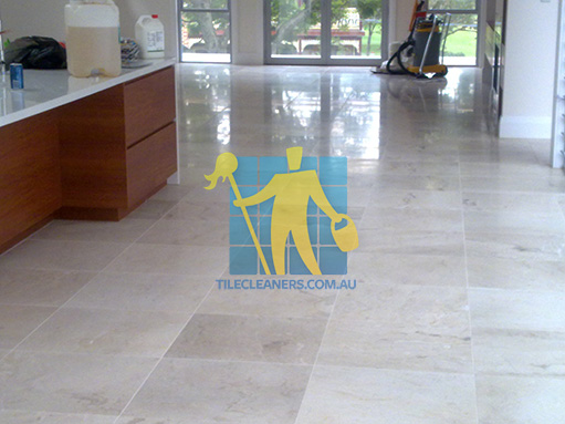 travertine tiles in large empty livingtoom large tiles after cleaning with machines in back Canberra