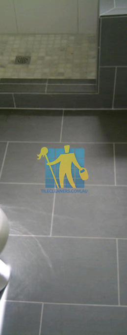 traditional bathroom floor with master bathroom with porcelain grey floor rectangular with white grout lines Adelaide Airport Adelaide Airport