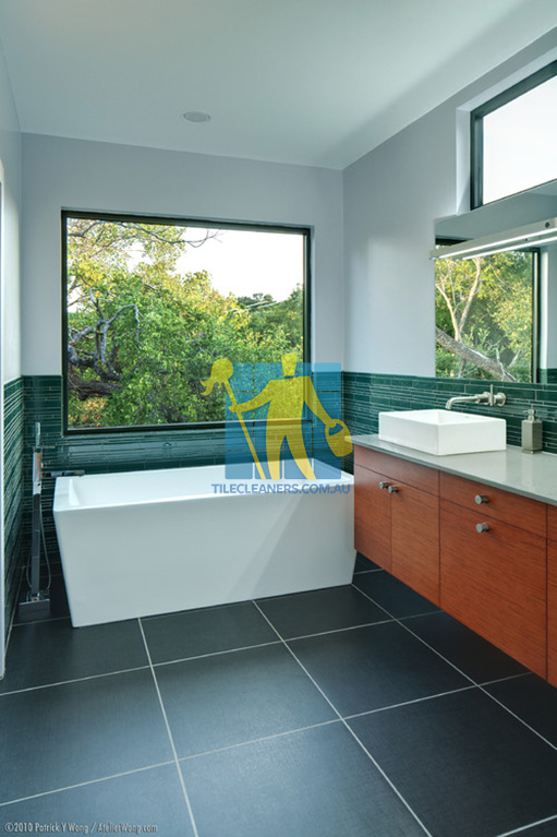 modern bathroom with extra large porcelain tiles that look like fake granite Gould Creek