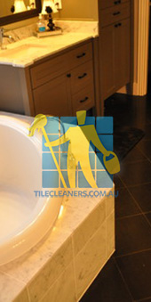 traditional bathroom with black granite tiles on the floor Melbourne