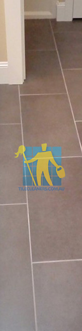 traditional bathroom with brown porcelain tiles rectangular with white grout lines Gold Coast