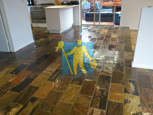 Ballarat shiny floor with slate tiles after sealing still looking wet dark regular shape and size