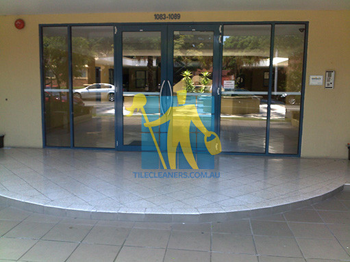 terrazzo tiles building entrance empty before cleaning angle shot reflection Tile Cleaning Oxenford
