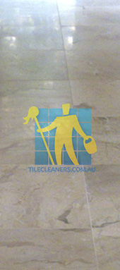 close shot of travertine tiles in large empty livingtoom large tiles after cleaning Sydney