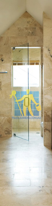 travertine tiles bathroom floor wall shower with dark veining Brisbane