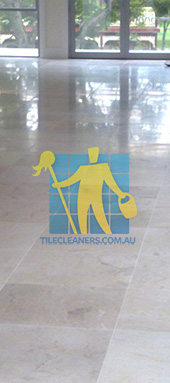 travertine tiles in large empty livingtoom large tiles after cleaning with machines in back Canberra/Molonglo Valley/Denman Prospect
