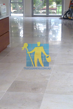 travertine tiles in large empty livingtoom large tiles after cleaning with machines in back Canberra/Molonglo Valley/Coombs