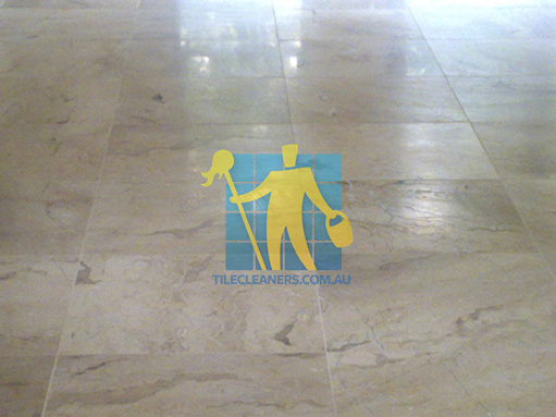 close shot of travertine tiles in large empty living room large tiles after cleaning Como